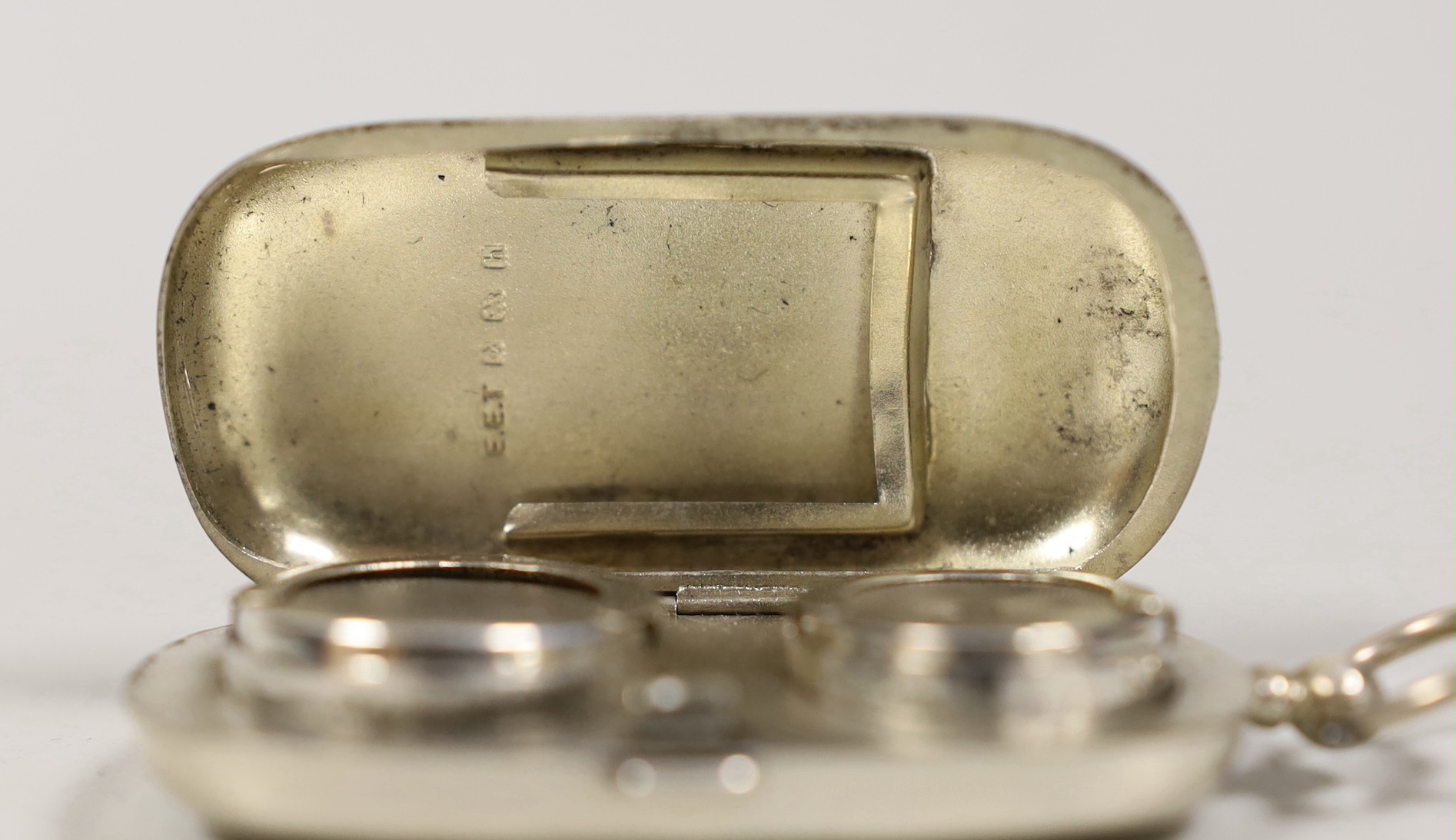 An Edwardian silver combination sovereign / half sovereign and stamp case, maker E.E.T. Birmingham, 1907, overall 74mm.